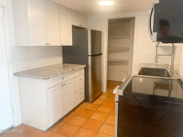 a kitchen with a stove and a microwave