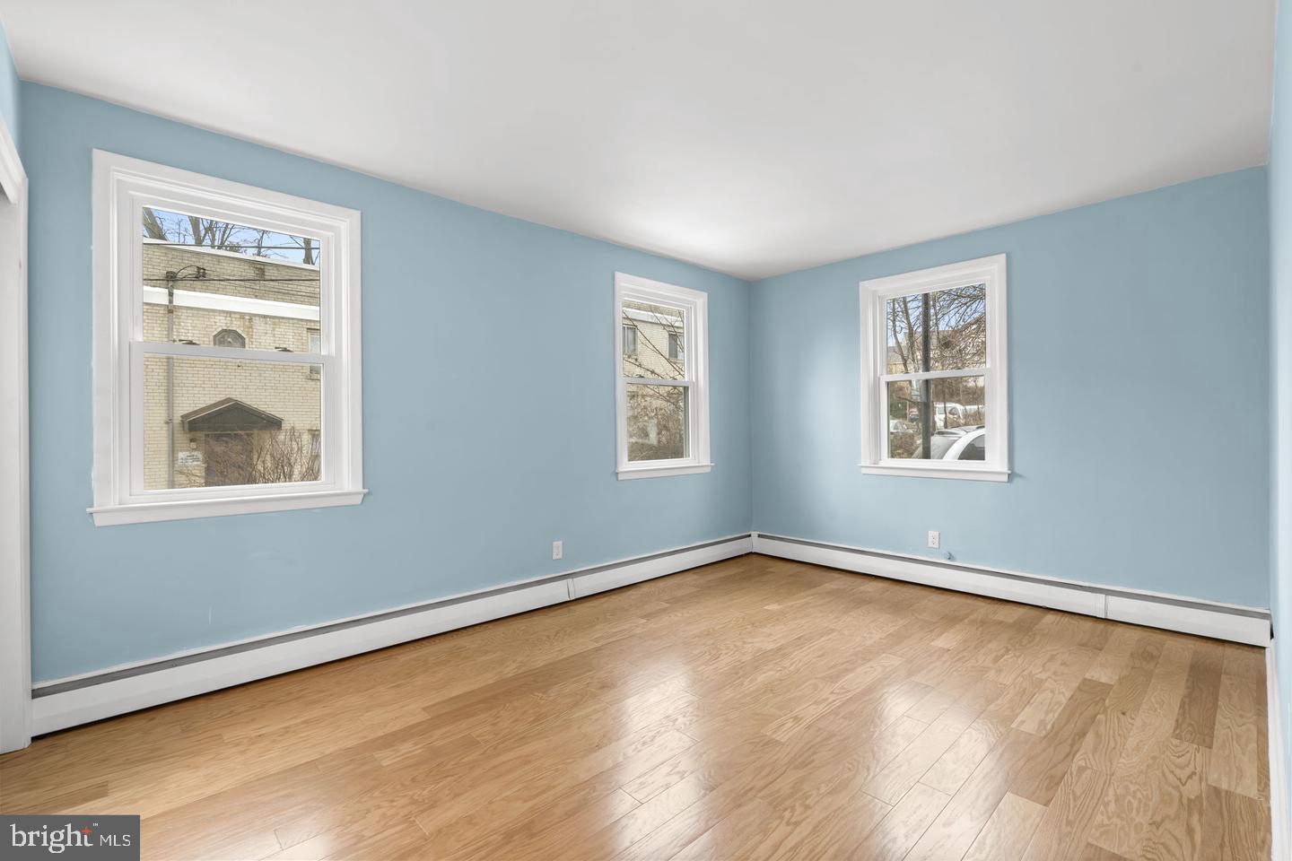 46 South State Road Upper Darby, PA 19082 - Photo 12 of 32 a view of empty room with window and wooden floor