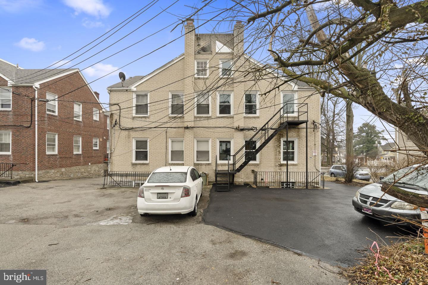 46 South State Road Upper Darby, PA 19082 - Photo 26 of 32 a car parked in front of a white house
