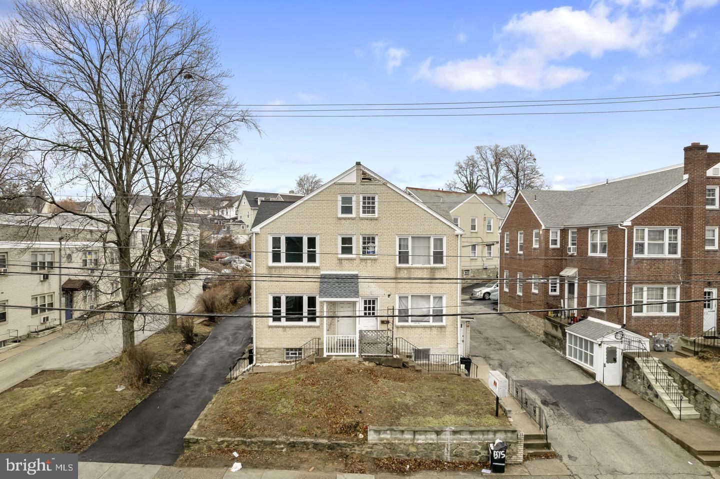 46 South State Road Upper Darby, PA 19082 - Photo 27 of 32 a view of a white house next to a yard with large trees
