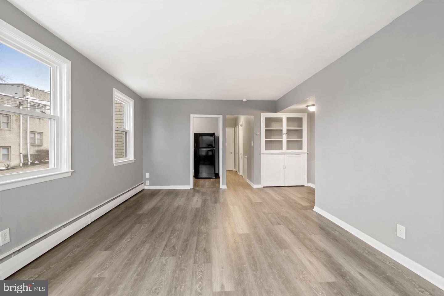 46 South State Road Upper Darby, PA 19082 - Photo 4 of 32 wooden floor in an empty room with a window