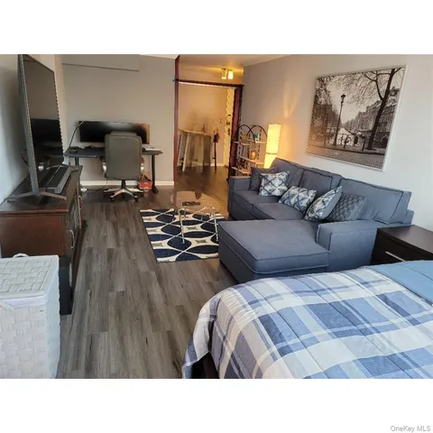 a room with gym equipment and a flat screen tv