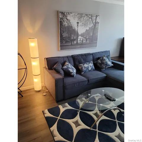 a open area with a cabinet and wall