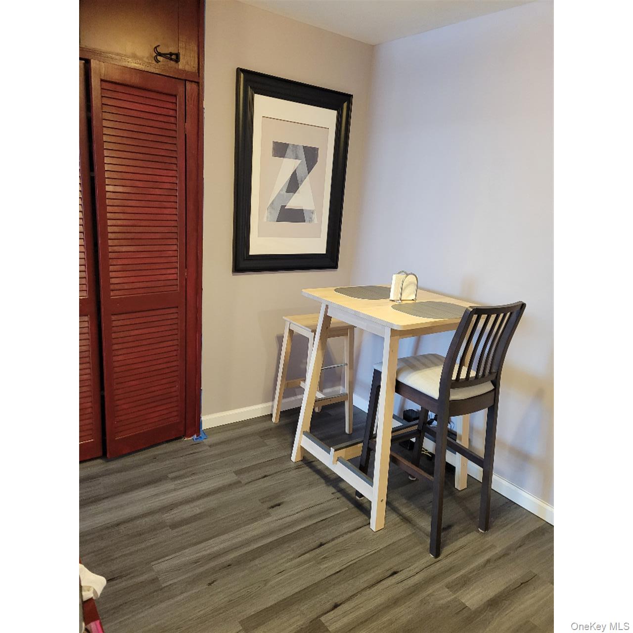 118-18 Union Turnpike, Unit 5J Queens, NY 11415 - Photo 15 of 24 a view of a dining room with furniture and wooden floor