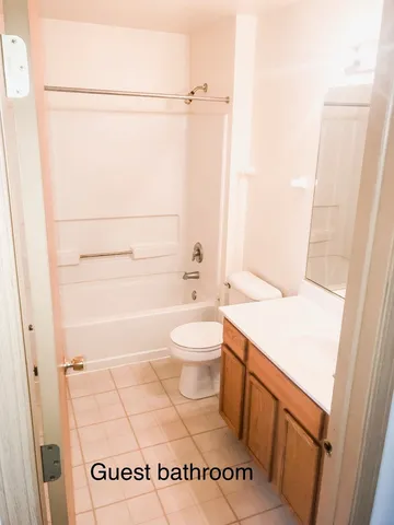 a bathroom with a toilet a sink and a shower