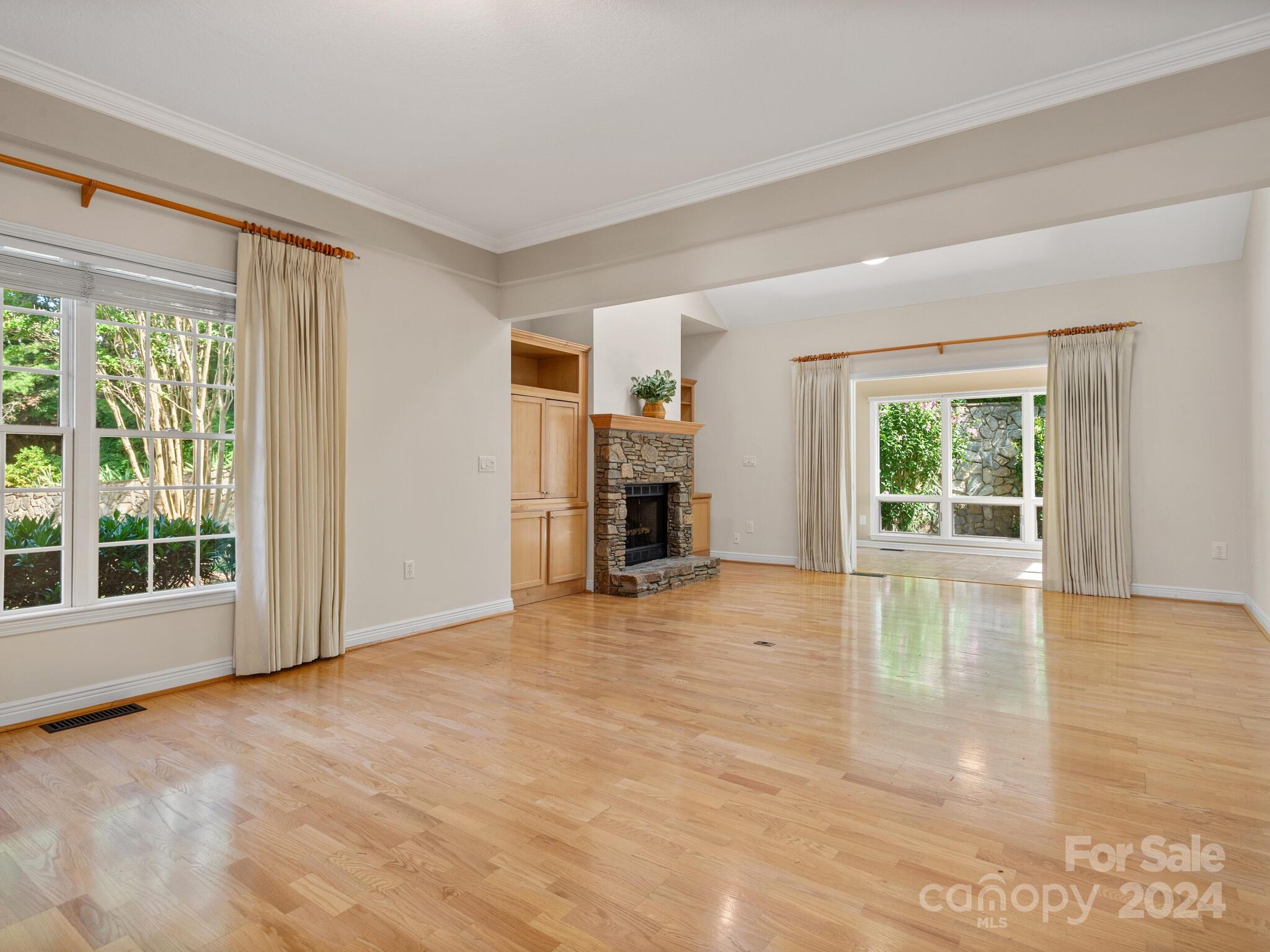 56 Pinnacle Point Drive Asheville, NC 28805 - Photo 11 of 38 a view of empty room with wooden floor and fireplace