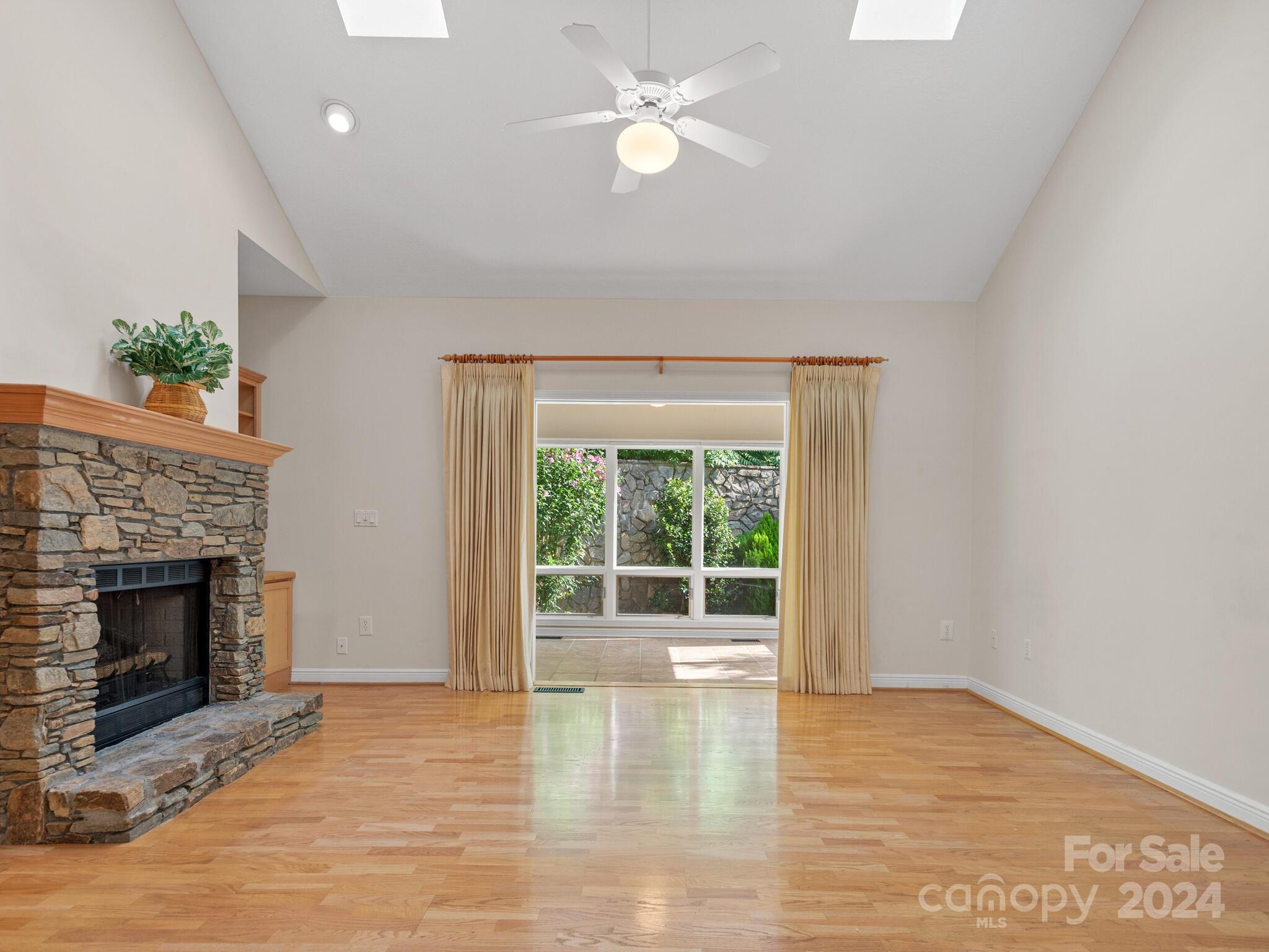56 Pinnacle Point Drive Asheville, NC 28805 - Photo 12 of 38 a view of empty room with wooden floor and fireplace