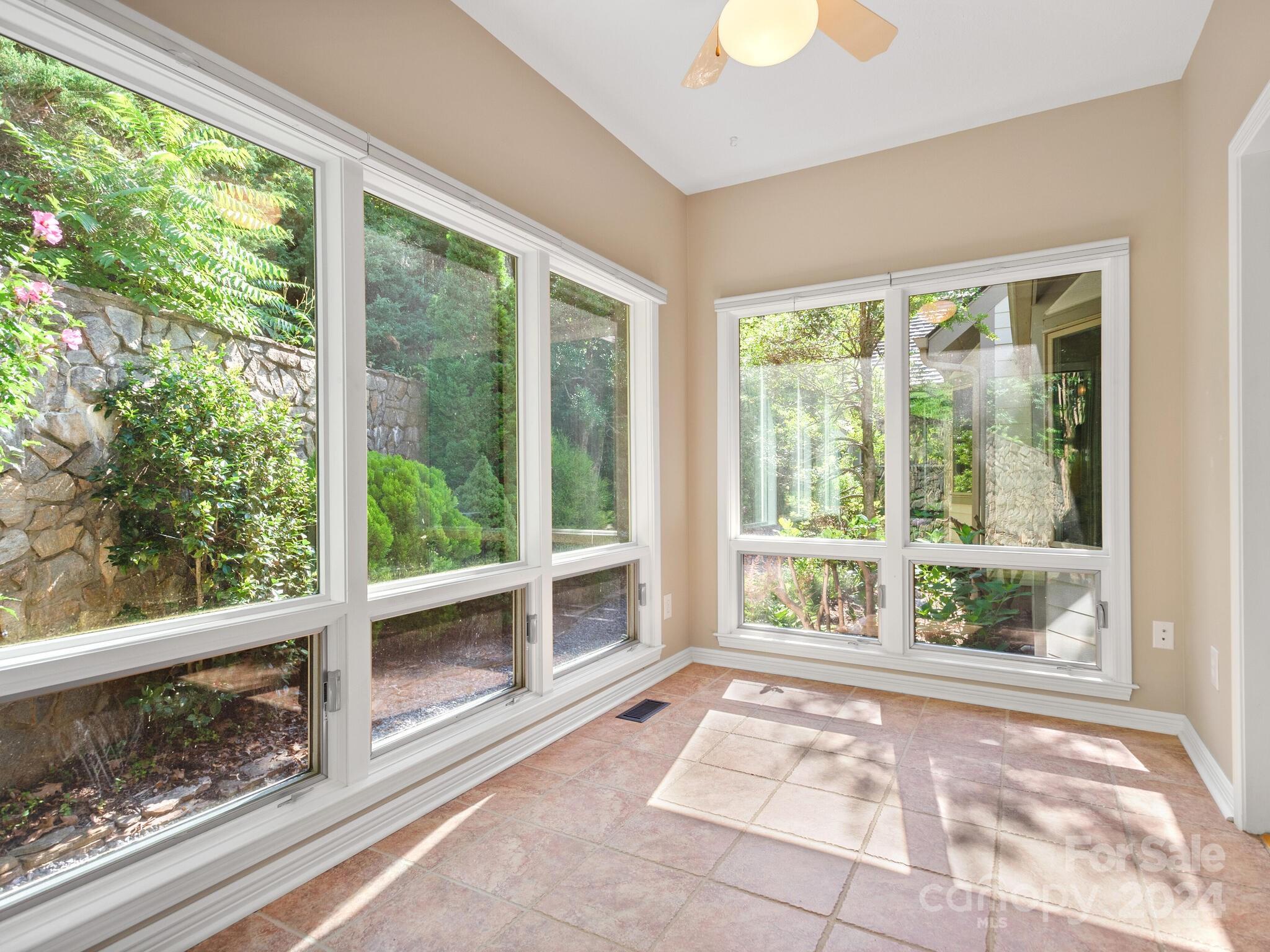 56 Pinnacle Point Drive Asheville, NC 28805 - Photo 15 of 38 a view of a garden from a windows room