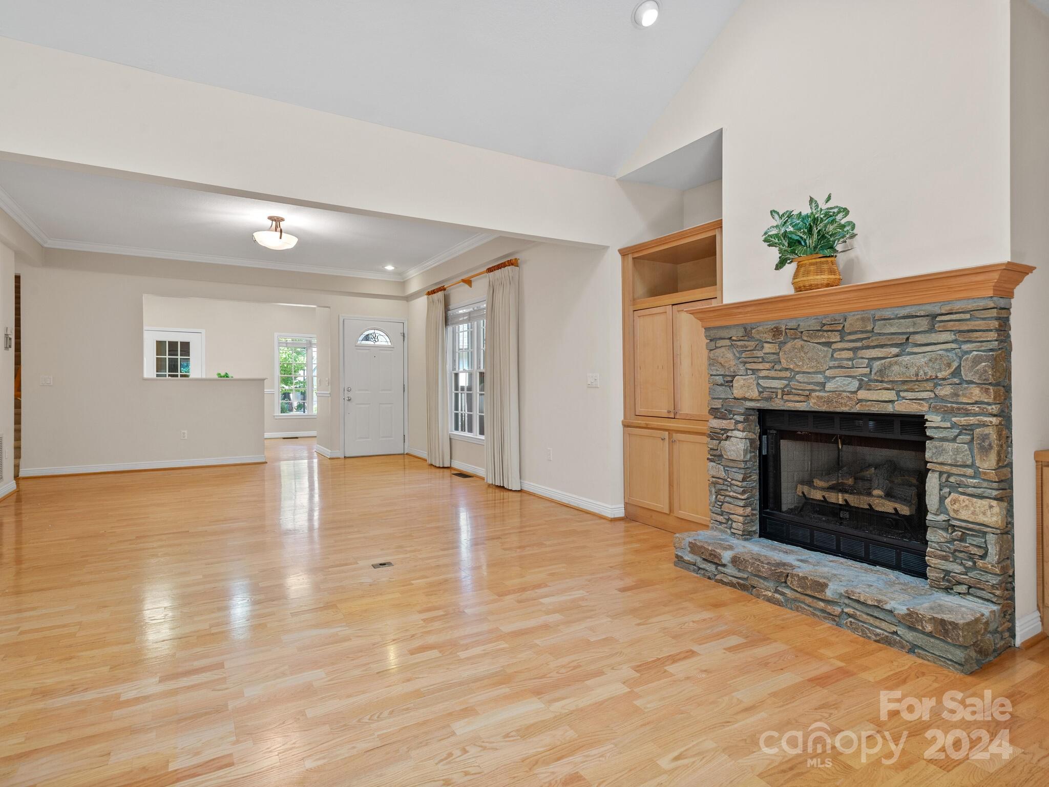56 Pinnacle Point Drive Asheville, NC 28805 - Photo 16 of 38 a view of an empty room with wooden floor fireplace and a window