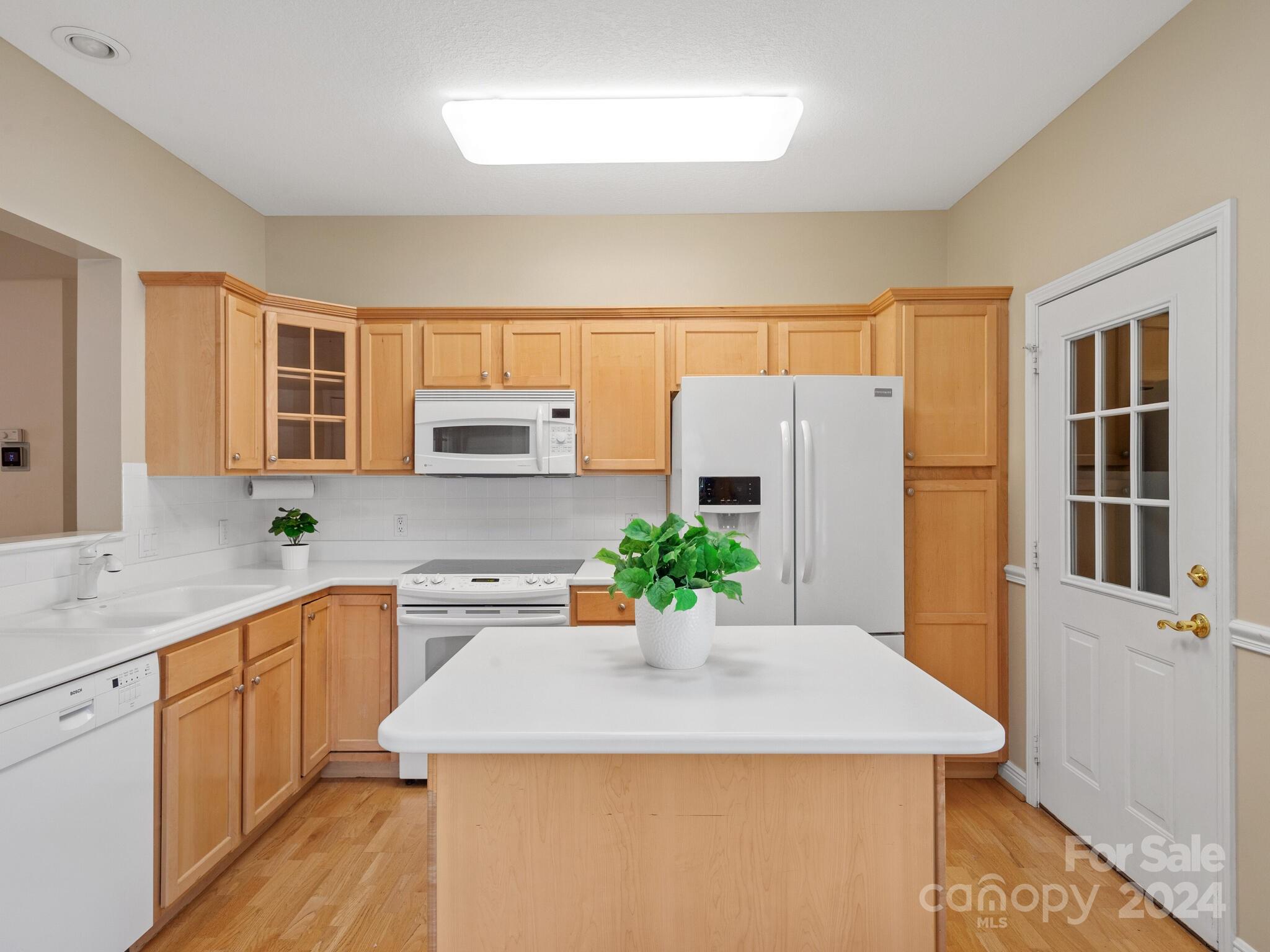 56 Pinnacle Point Drive Asheville, NC 28805 - Photo 17 of 38 a kitchen with a sink a stove a refrigerator and a window