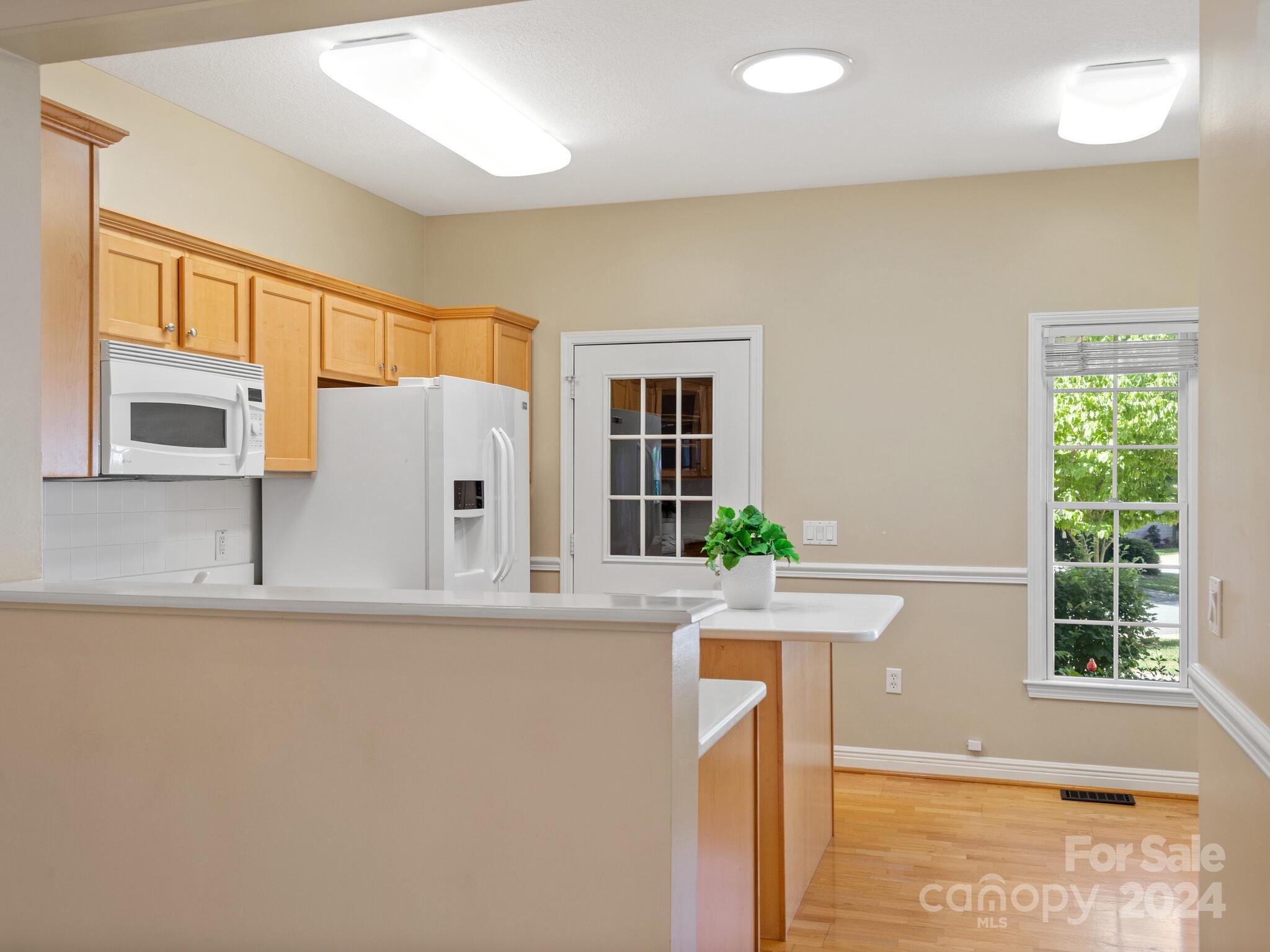 56 Pinnacle Point Drive Asheville, NC 28805 - Photo 18 of 38 a kitchen with stainless steel appliances granite countertop a sink and a window