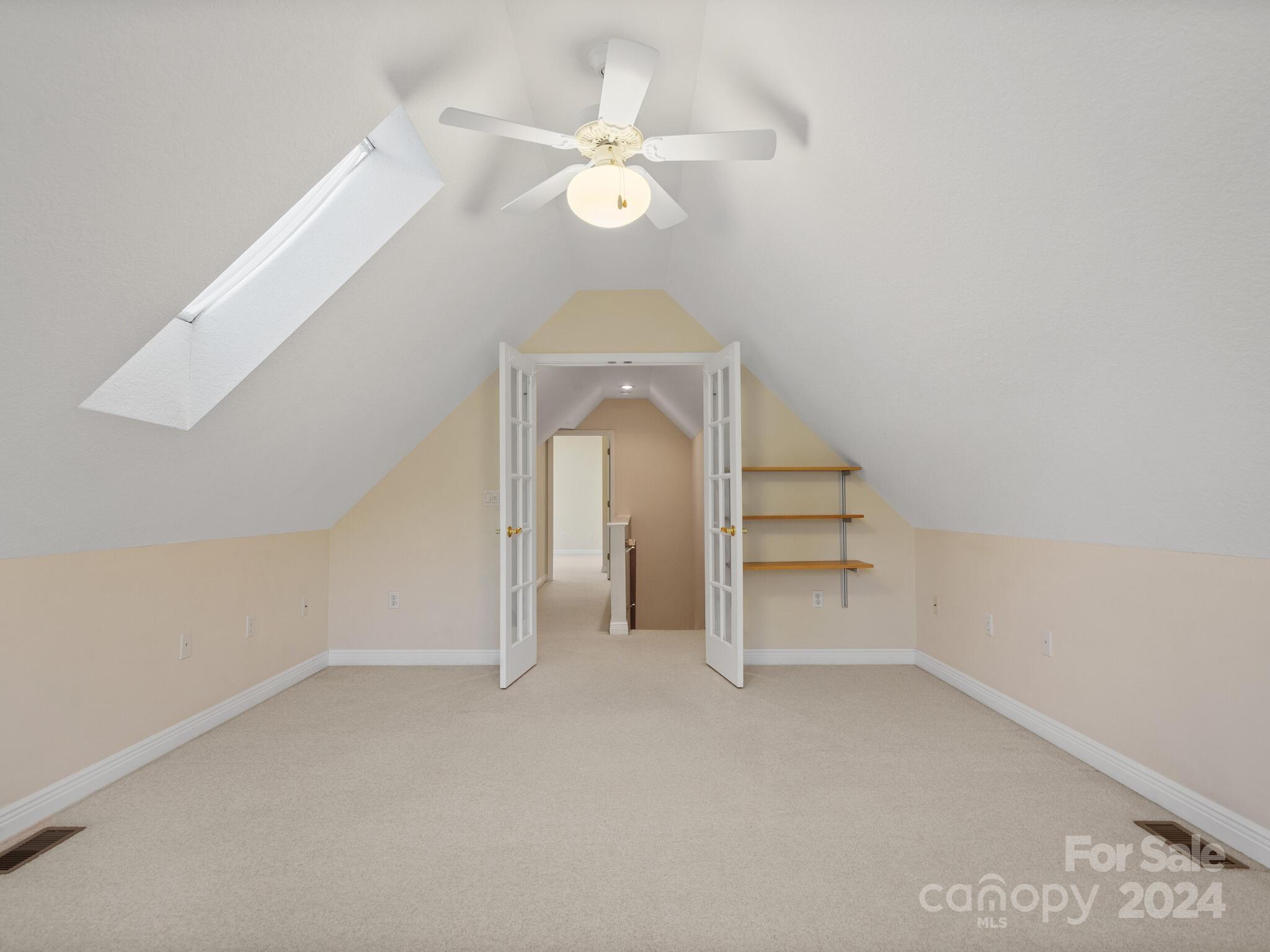56 Pinnacle Point Drive Asheville, NC 28805 - Photo 27 of 38 an empty room with a ceiling fan and staircase