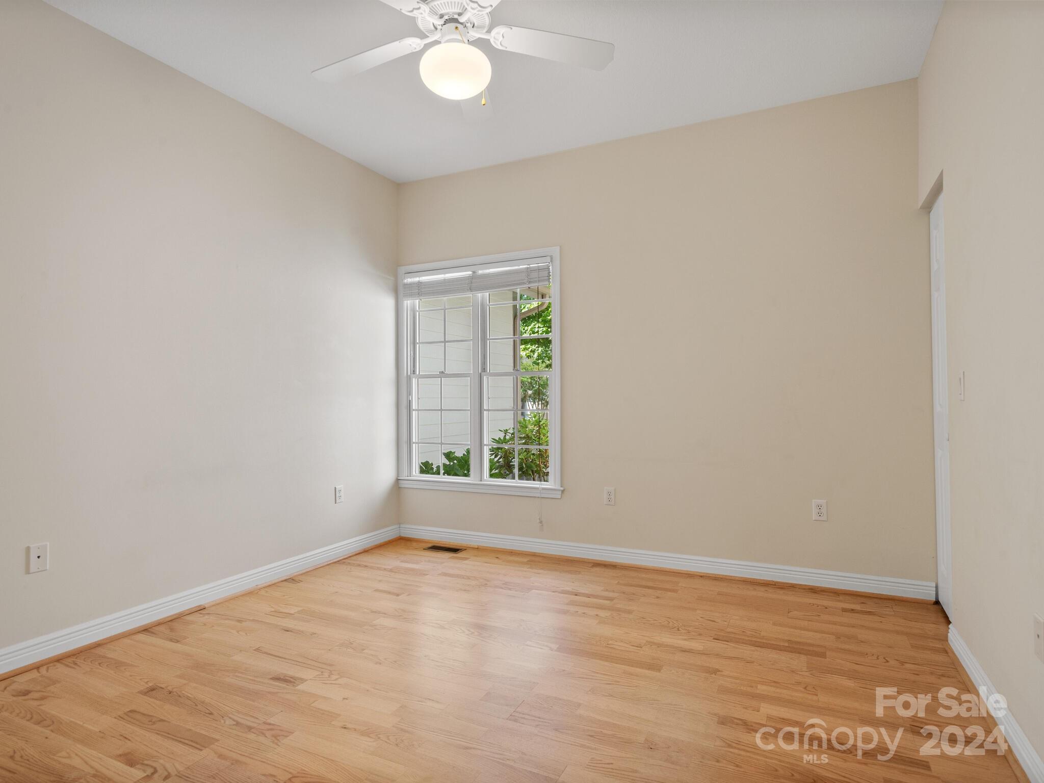 56 Pinnacle Point Drive Asheville, NC 28805 - Photo 29 of 38 an empty room with wooden floor and windows