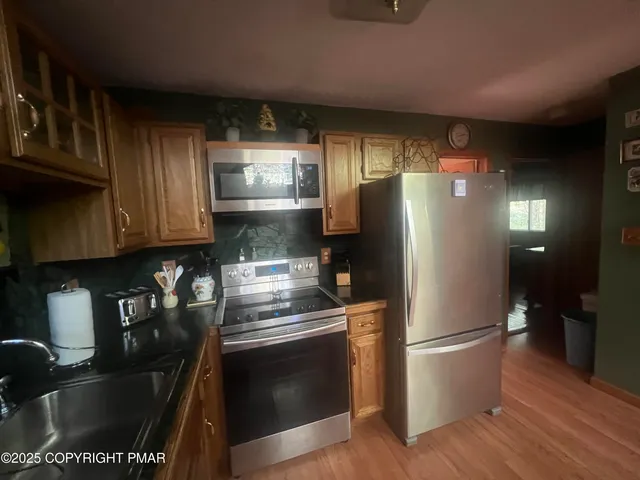 a bathroom with a shower and a sink