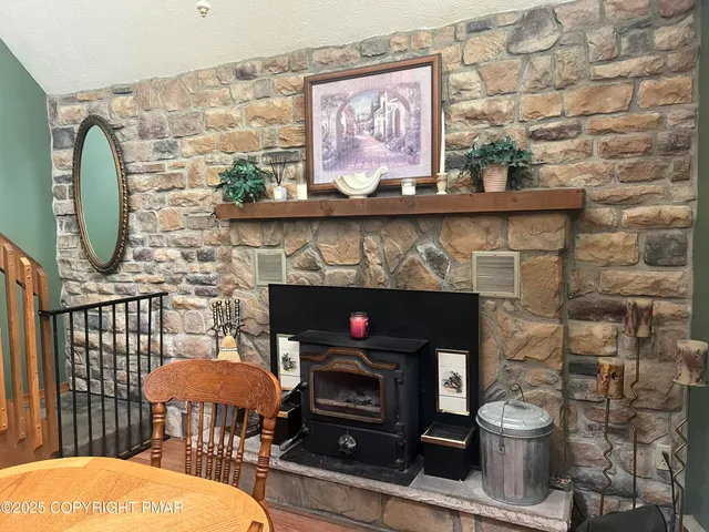 a en suite bathroom with a granite countertop sink and a mirror