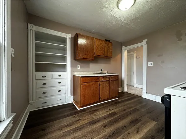 a kitchen with stainless steel appliances a stove and a refrigerator
