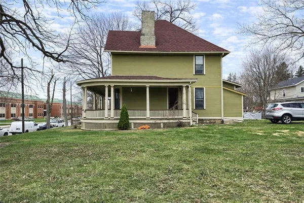 a view of a house with a yard