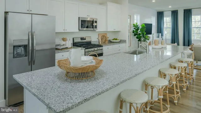 a bathroom with a granite countertop double vanity sink and a mirror