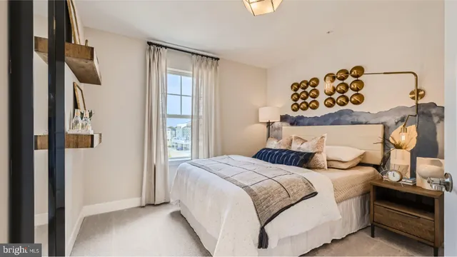 a bed room with a bed and a window