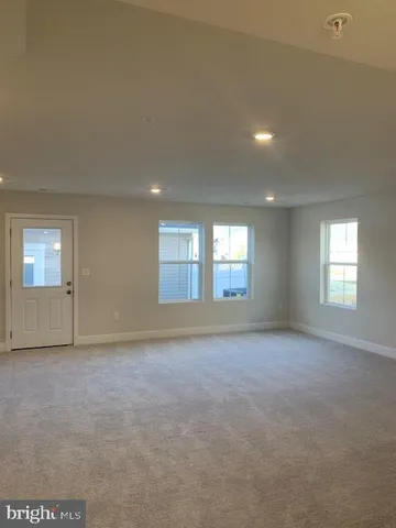 a view of empty room with windows