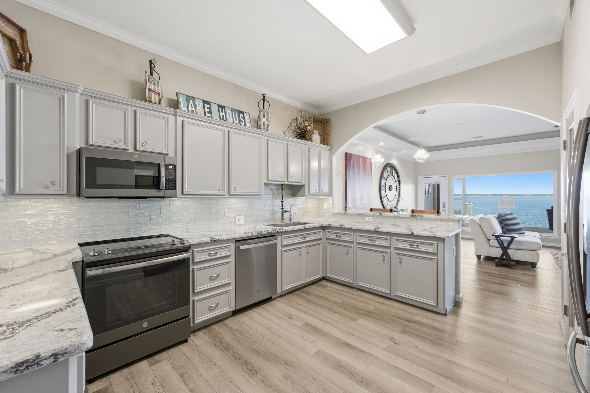 2 Regency Point Conroe, TX 77356 - Photo 12 of 44 Seamless flow to the living area with beautiful open water views.