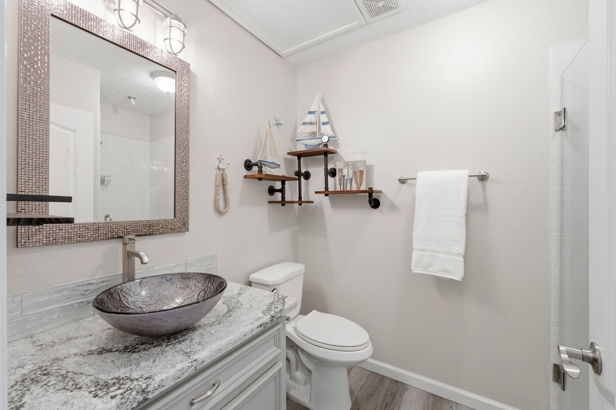 2 Regency Point Conroe, TX 77356 - Photo 14 of 44 Full bathroom off the main entry featuring Cambria quartz countertops, vessel sink, and updated finishes.