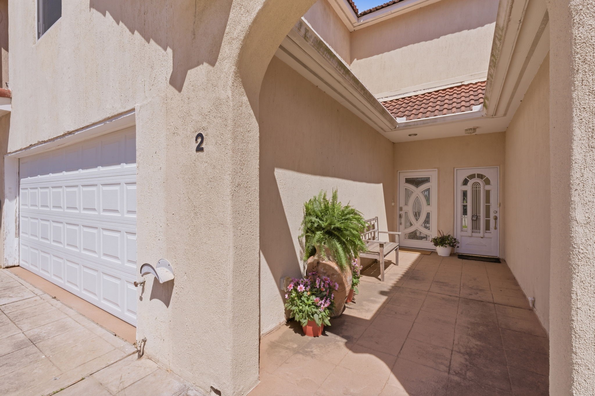 2 Regency Point Conroe, TX 77356 - Photo 2 of 44 Semi-private courtyard-style entry leading to the front door.