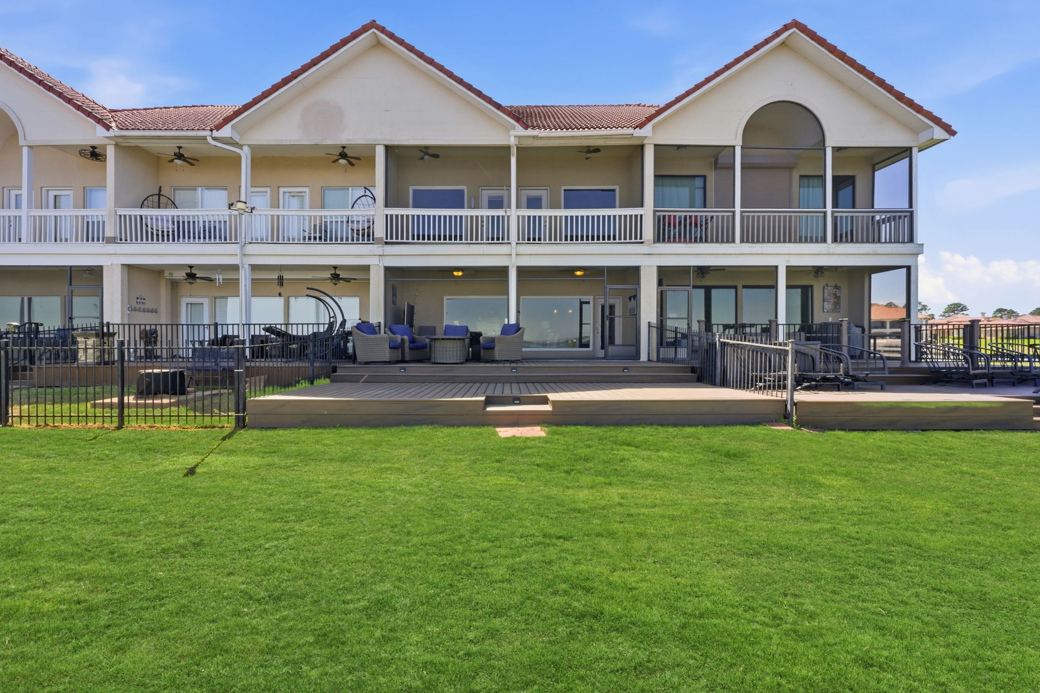 2 Regency Point Conroe, TX 77356 - Photo 34 of 44 Beautifully maintained waterfront setting featuring a lush green lawn and expansive open water views—lake living at its finest.