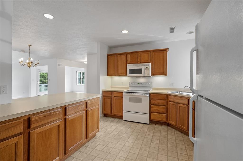 903 Hidden Meadows Circle Renfrew, PA 16053 - Photo 16 of 44 a kitchen with cabinets appliances and a sink