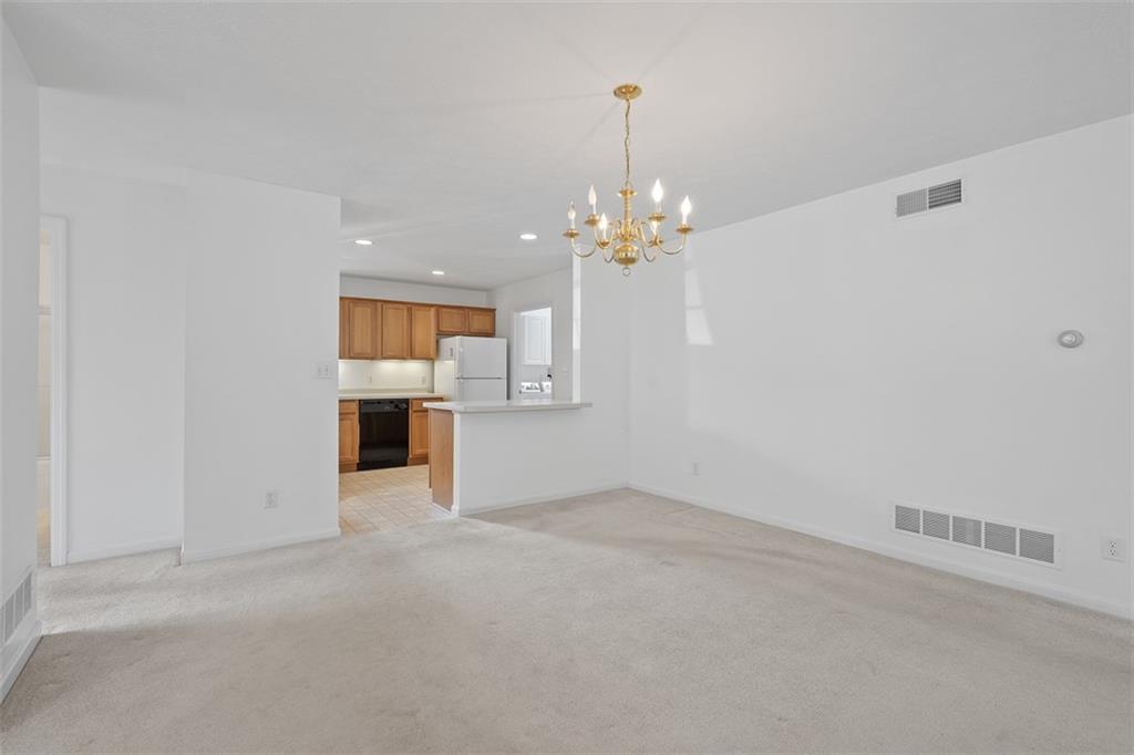 903 Hidden Meadows Circle Renfrew, PA 16053 - Photo 21 of 44 a view of a kitchen with a sink and dishwasher with wooden floor