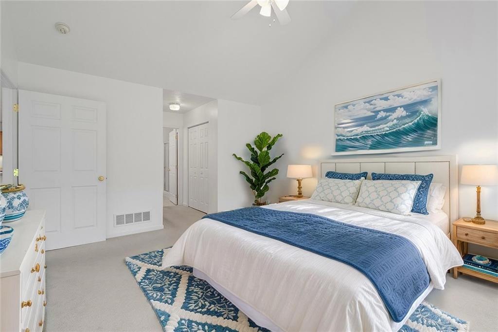 903 Hidden Meadows Circle Renfrew, PA 16053 - Photo 27 of 44 a bedroom with a large bed and a chandelier