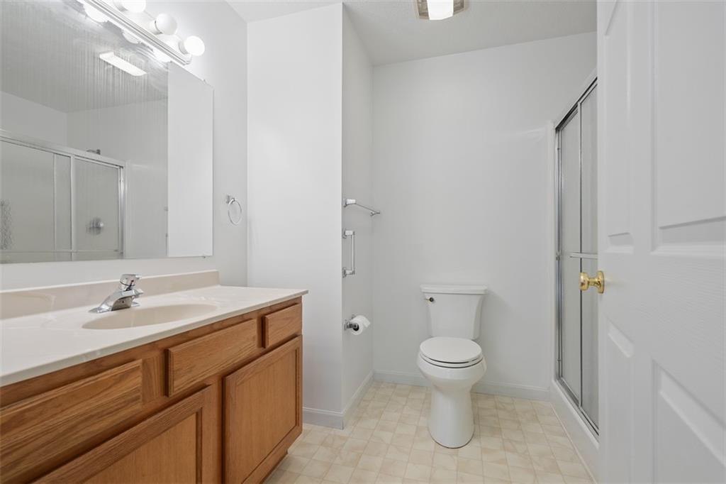 903 Hidden Meadows Circle Renfrew, PA 16053 - Photo 32 of 44 a spacious bathroom with a granite countertop sink a toilet and a mirror