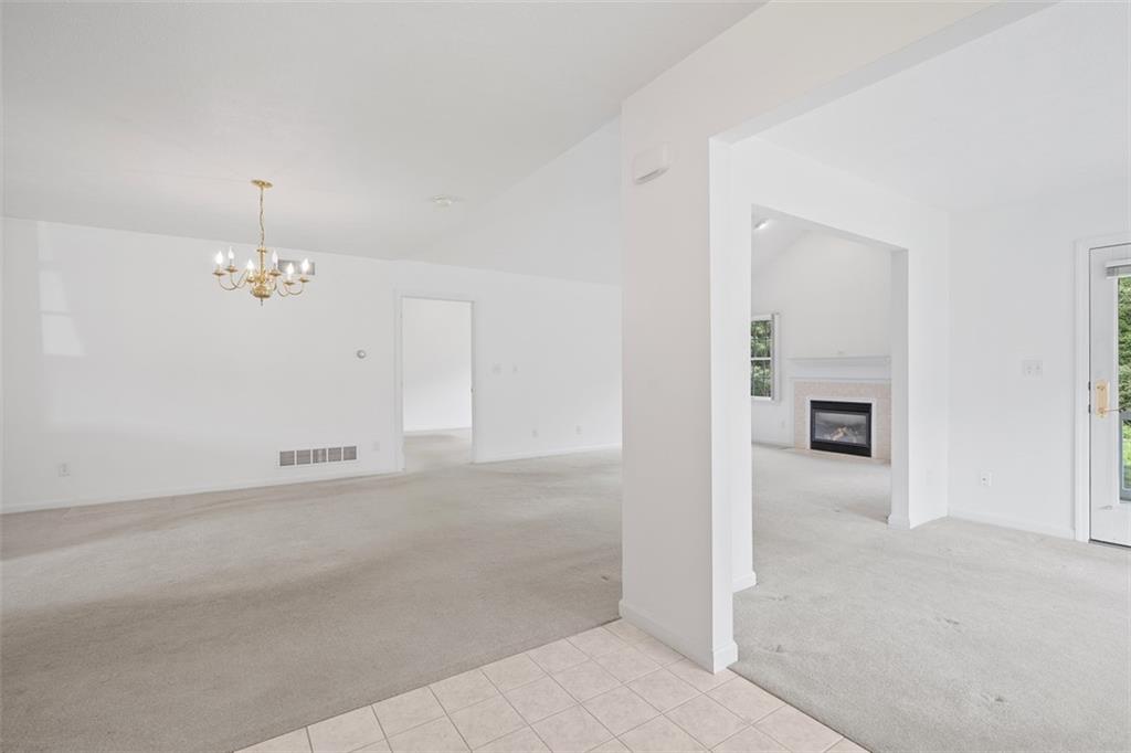 903 Hidden Meadows Circle Renfrew, PA 16053 - Photo 4 of 44 an empty room with windows and fireplace