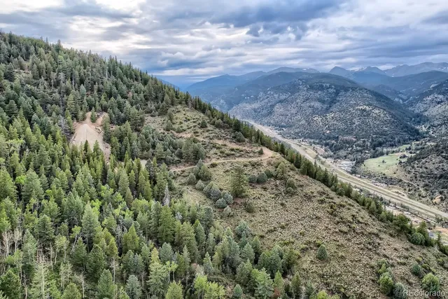 a view of a big yard with lots of green space