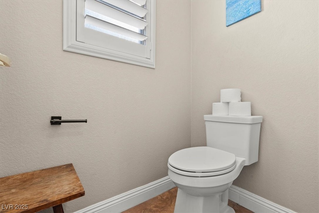 9031 West Viking Road Las Vegas, NV 89147 - Photo 26 of 33 Bathroom with toilet and baseboards