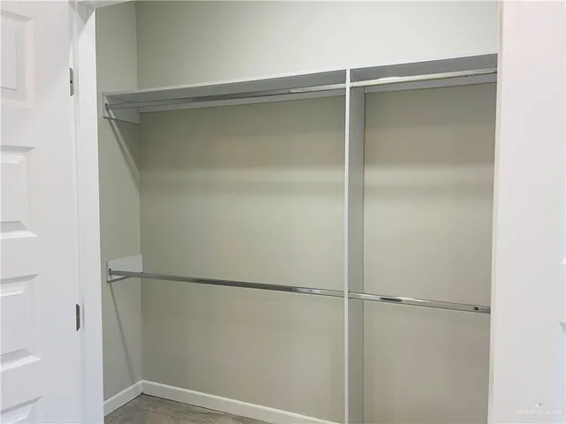 a view of an empty walk in closet