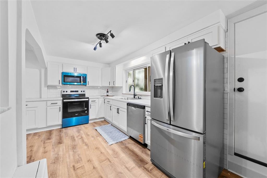 1812 Ridge Road Jeannette, PA 15644 - Photo 18 of 39 a kitchen with a refrigerator sink and stove top oven
