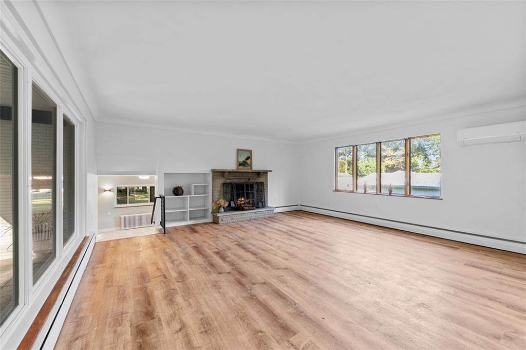 1812 Ridge Road Jeannette, PA 15644 - Photo 6 of 39 a view of empty room with fireplace and windows