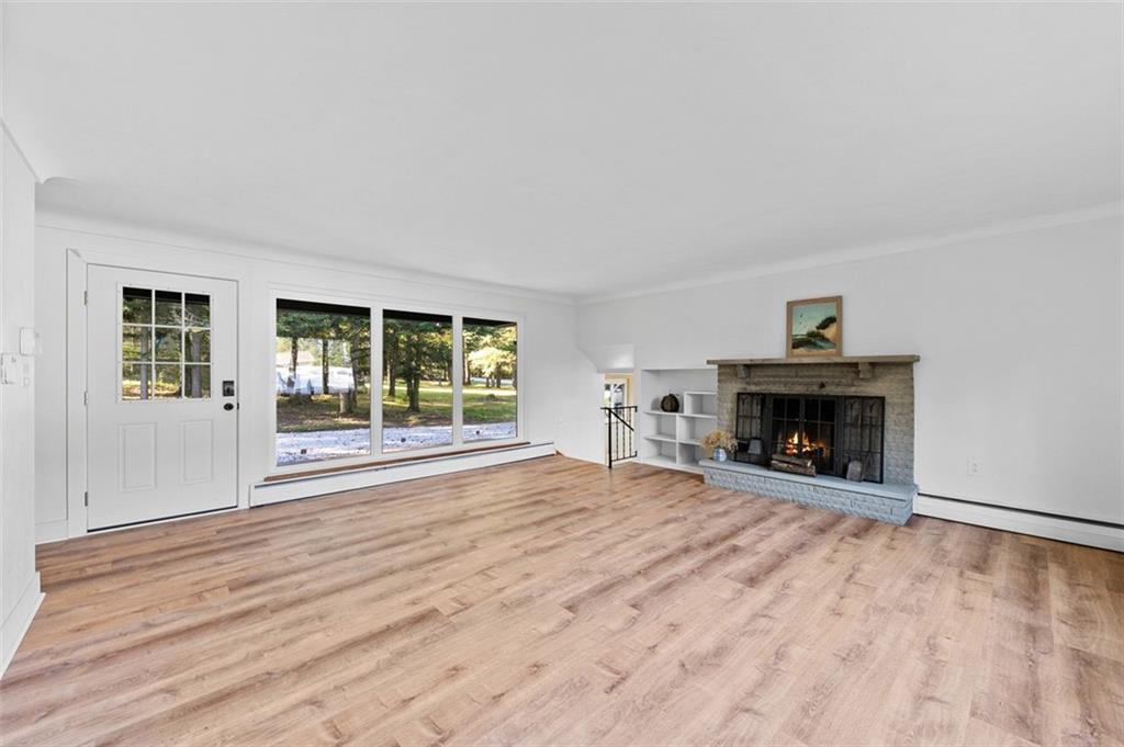 1812 Ridge Road Jeannette, PA 15644 - Photo 7 of 39 a view of an empty room with window and fire place