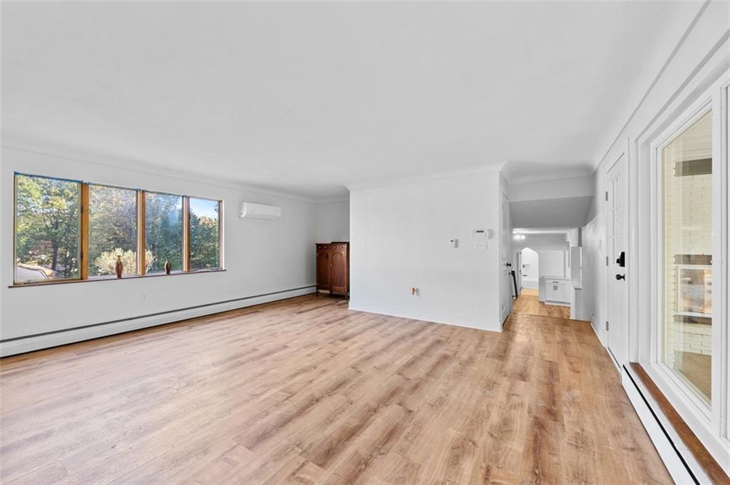 1812 Ridge Road Jeannette, PA 15644 - Photo 8 of 39 a view of empty room with wooden floor and fan