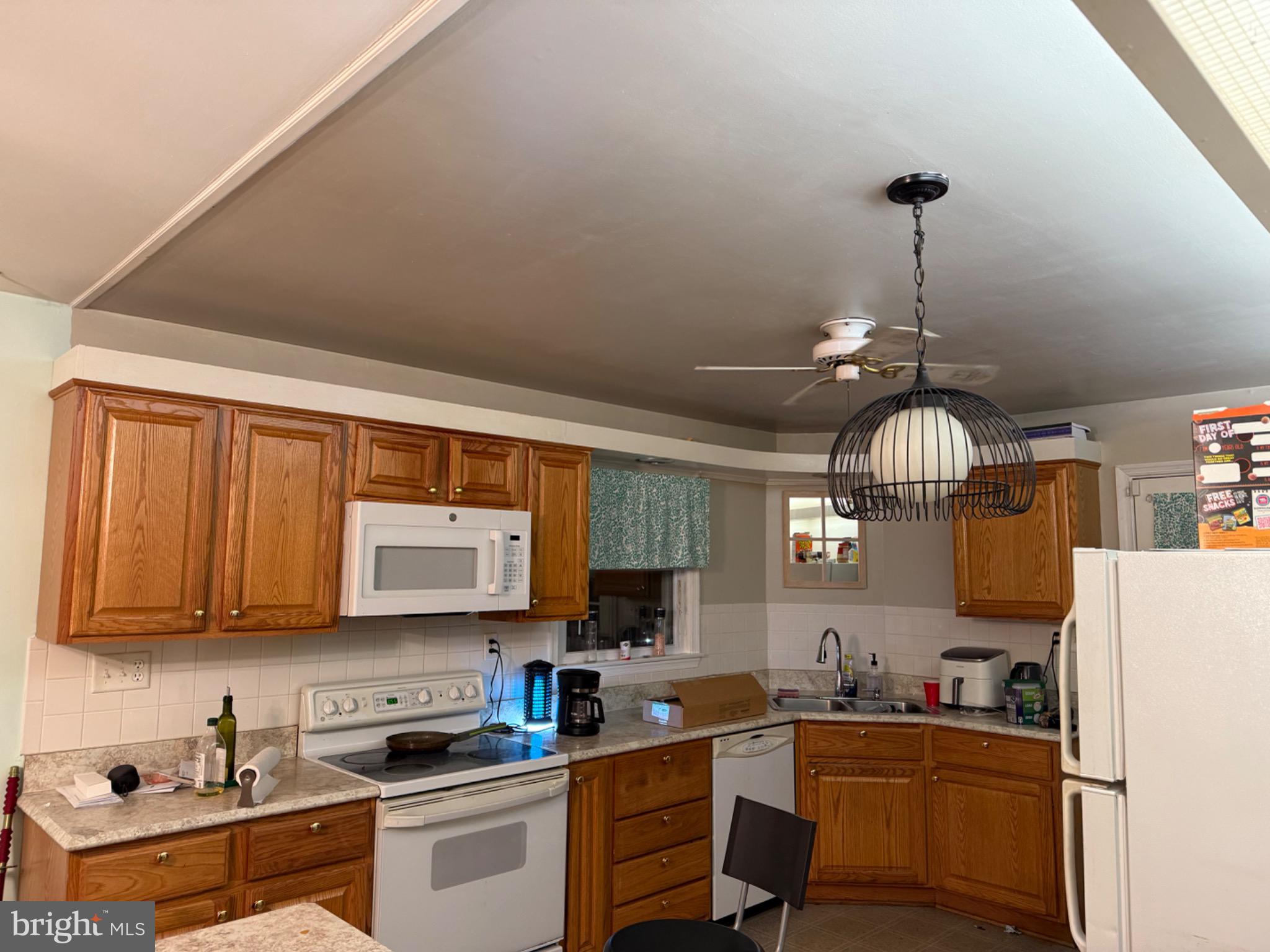 4305 Briggs Chaney Road Beltsville, MD 20705 - Photo 3 of 26 Cozy kitchen with warm wooden cabinetry.