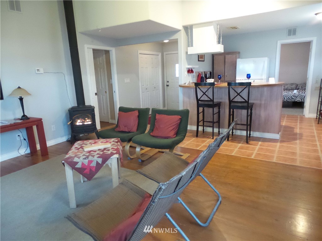 4227 Northeast North Shore Road Belfair, WA 98528 - Photo 5 of 14 a living room with furniture and wooden floor