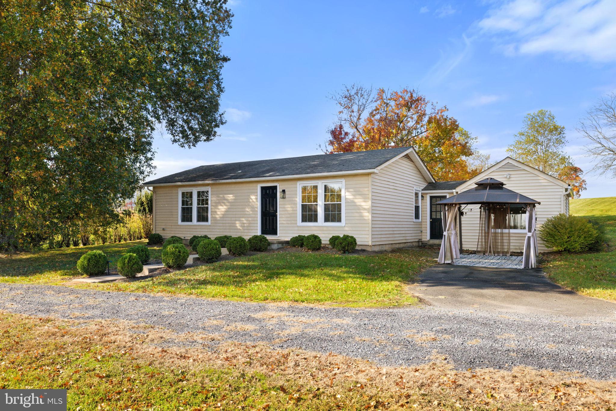 33018 Sunken Lane Upperville, VA 20184 - Photo 1 of 31 a view of a yard in front of a house with a patio