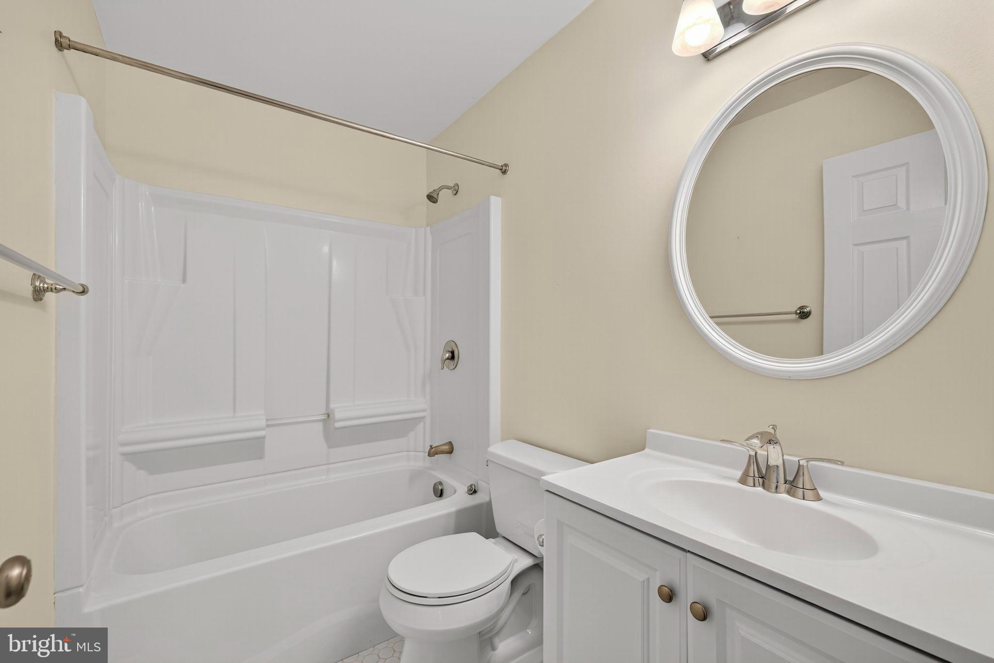 33018 Sunken Lane Upperville, VA 20184 - Photo 15 of 31 a bathroom with a sink a toilet and a mirror