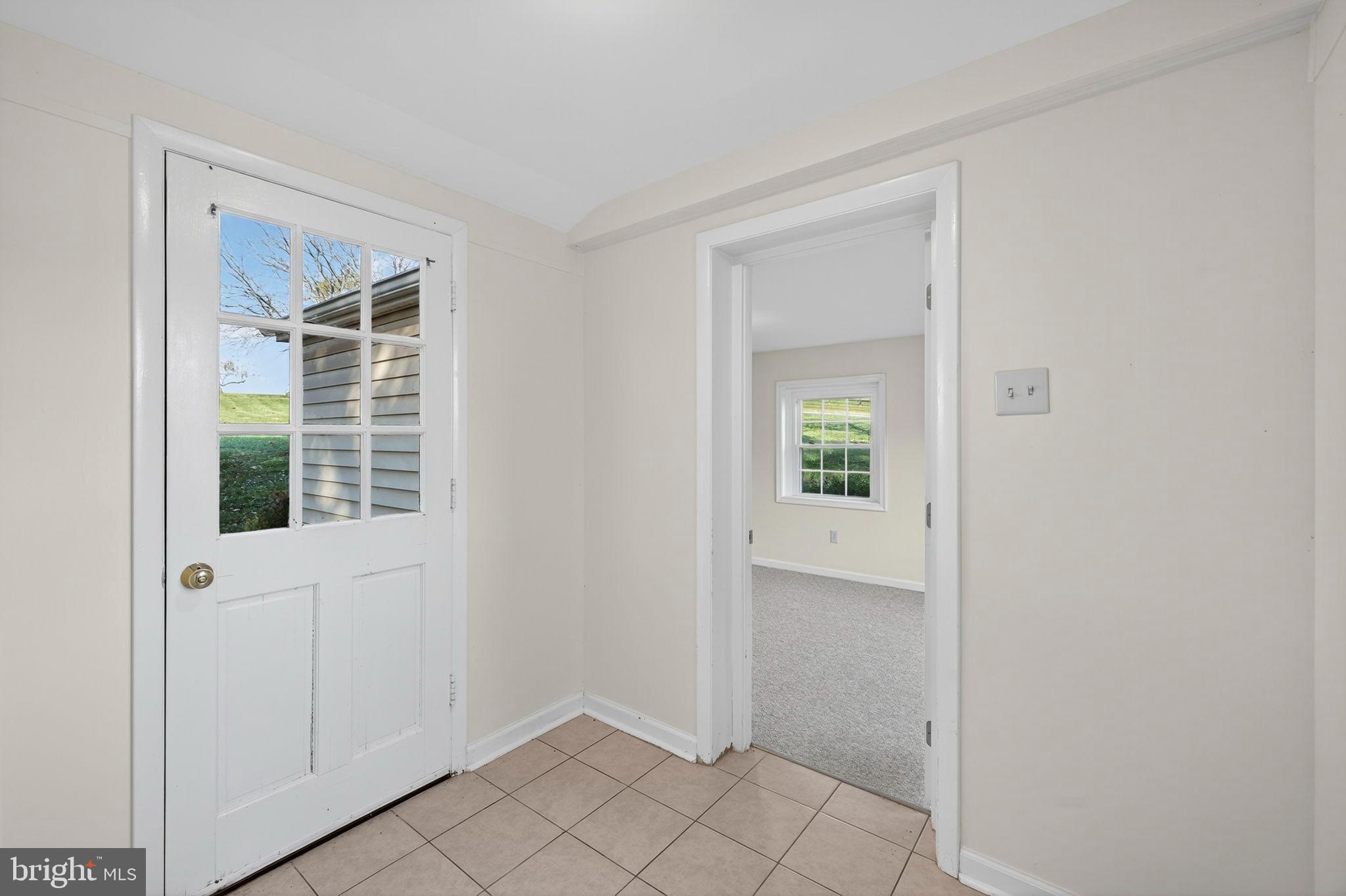 33018 Sunken Lane Upperville, VA 20184 - Photo 19 of 31 a view of an entryway with wooden floor