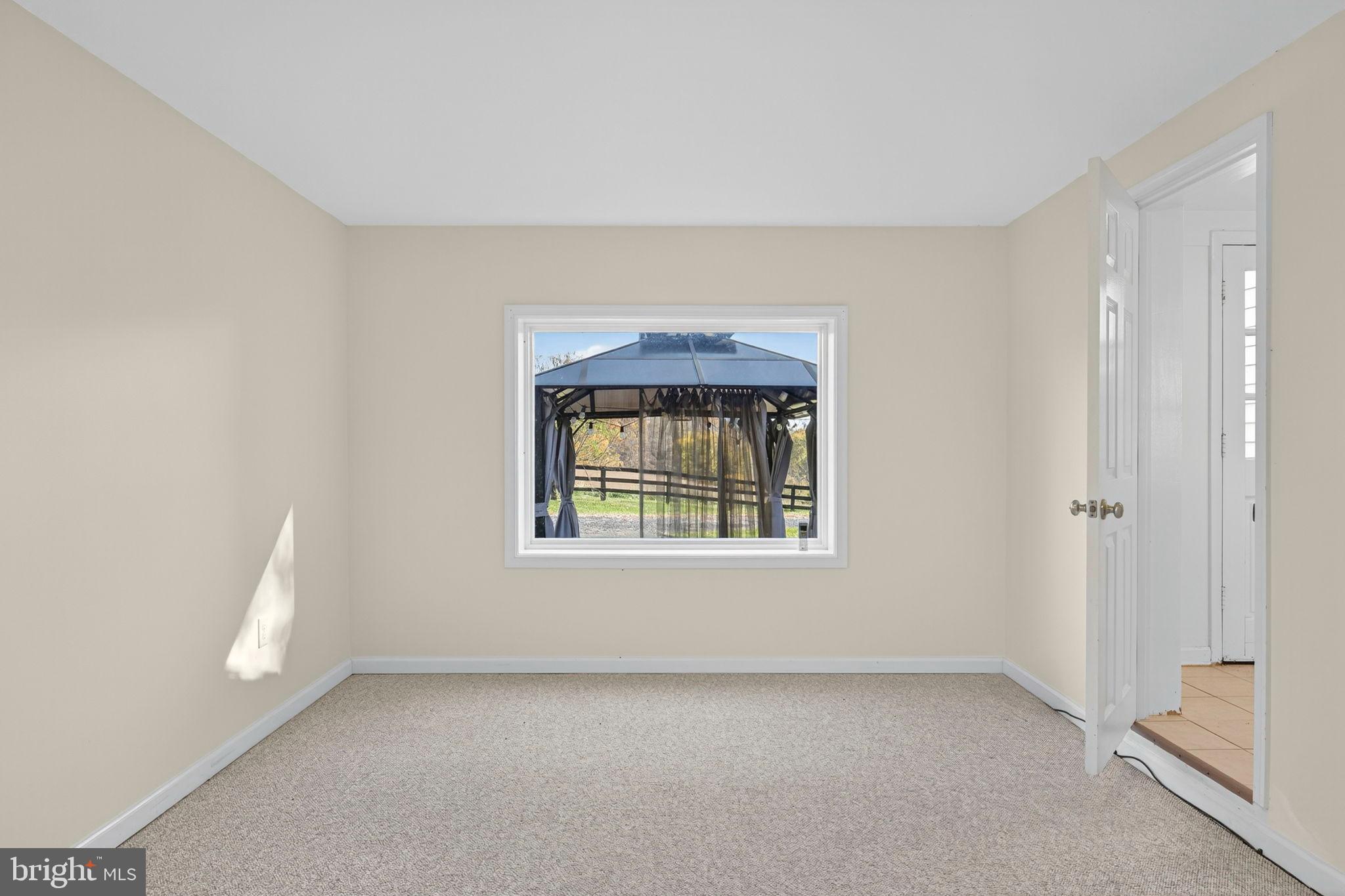 33018 Sunken Lane Upperville, VA 20184 - Photo 21 of 31 a view of an empty room with a window