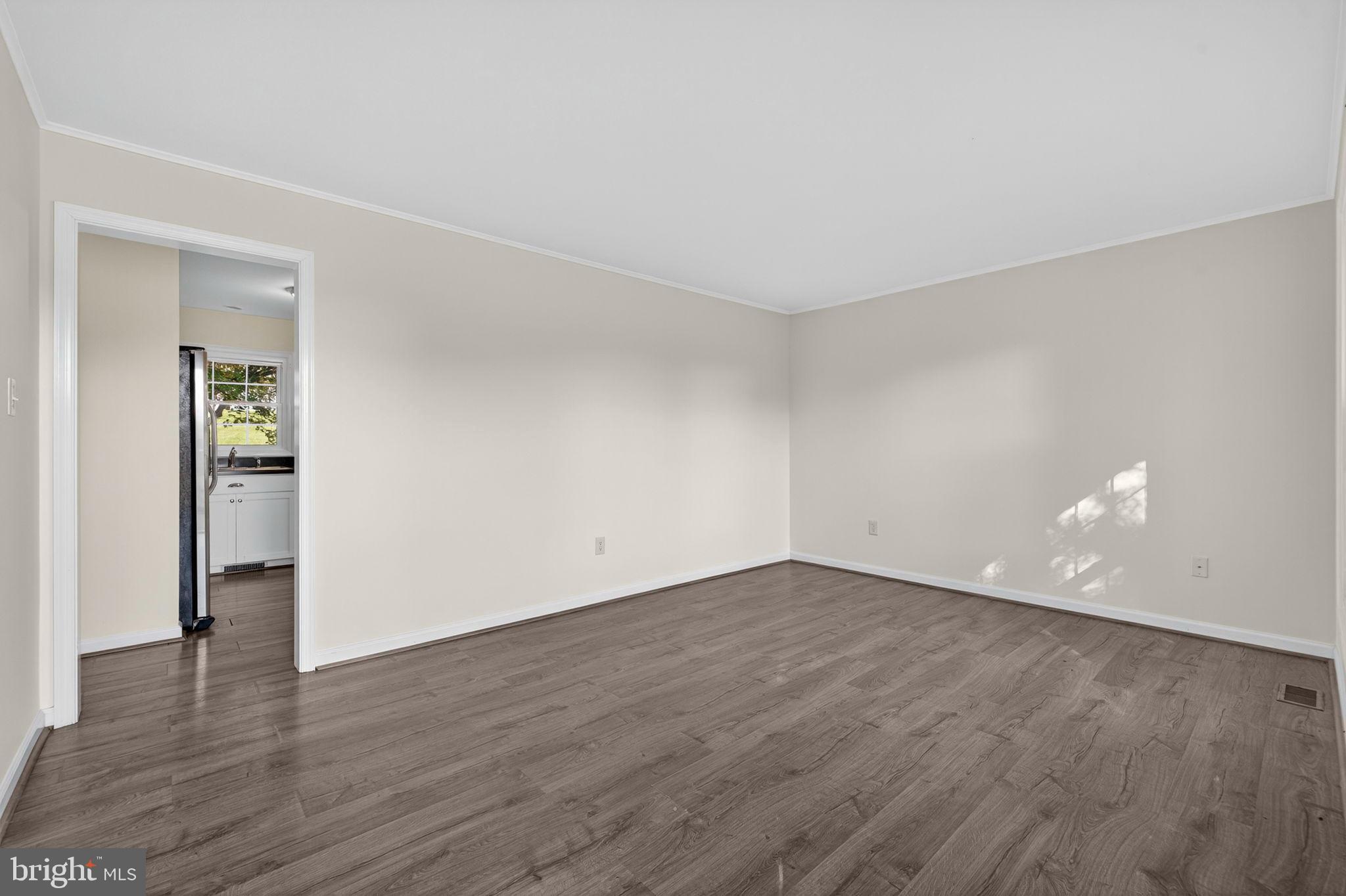 33018 Sunken Lane Upperville, VA 20184 - Photo 7 of 31 a view of an empty room with wooden floor and closet