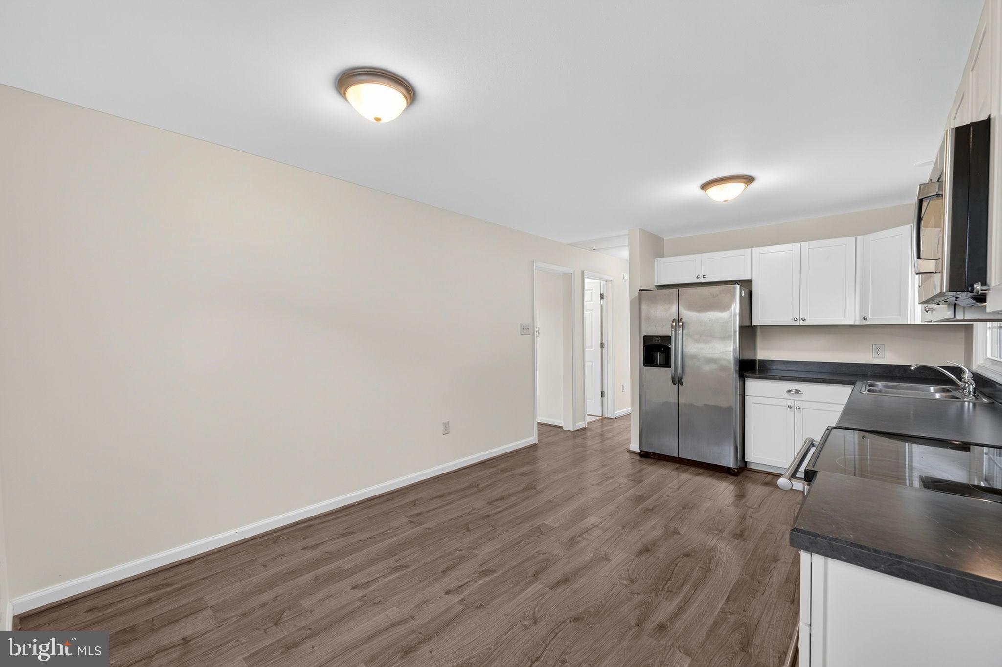 33018 Sunken Lane Upperville, VA 20184 - Photo 10 of 31 a view of a kitchen with a sink and a refrigerator