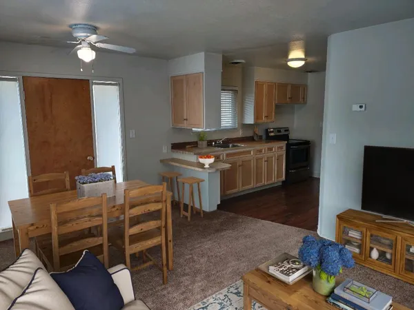 a kitchen with stainless steel appliances granite countertop a stove and a refrigerator