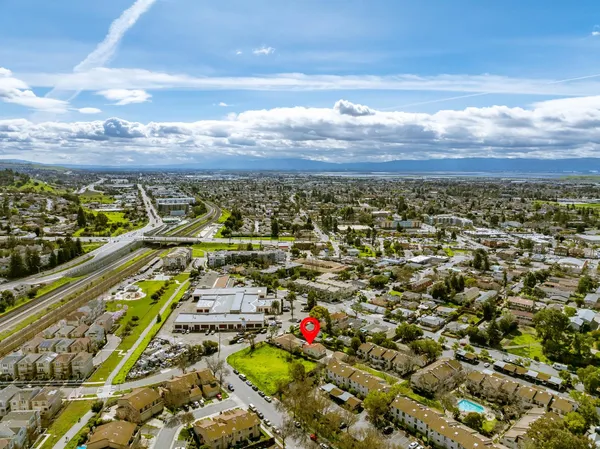 an aerial view of residential houses with outdoor space